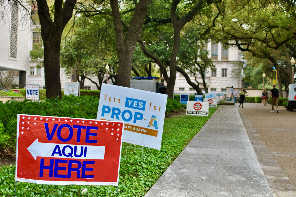 Signs for and against Prop A were placed outside a polling location in Austin, Texas.