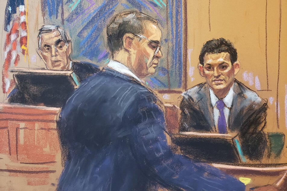 A courtroom sketch shows Sam Bankman-Fried being questioned by his defense lawyer, Mark Cohen, as he testifies in his fraud trial.