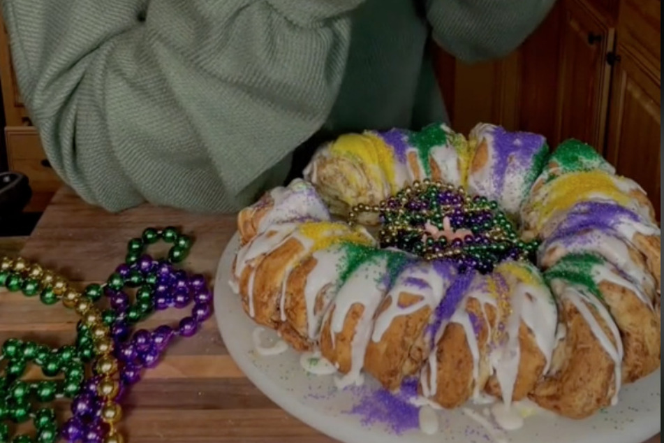 There are tons of king cake recipes out there, but you can use canned cinnamon rolls for a fast version.