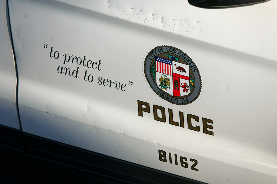Two LAPD officers were awarded millions in damages after they sued for gender discrimination in a case involving a Hitler-style mustache drawn on an arrested person.
