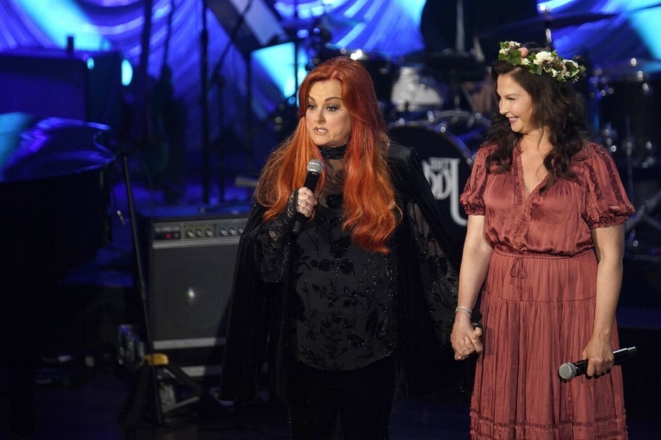 On Sunday, country music's finest joined Noami Judd's daughters Wynonna (l) and Ashley (r) at Nashville's Ryman Auditorium for a celebration of life.