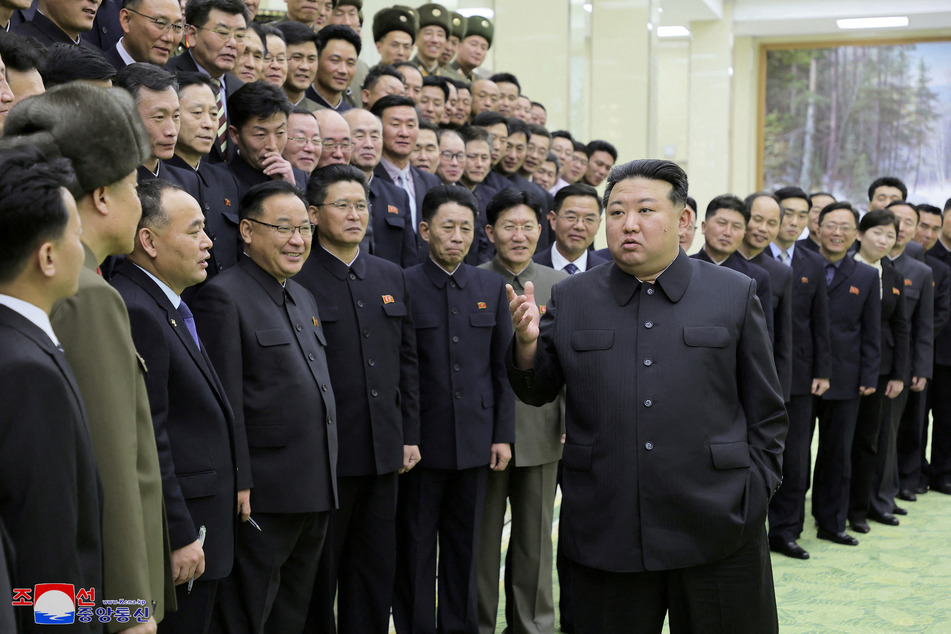 North Korea's leader Kim Jong-un meets with members of the Non-Standing Satellite Launch Preparation Committee.