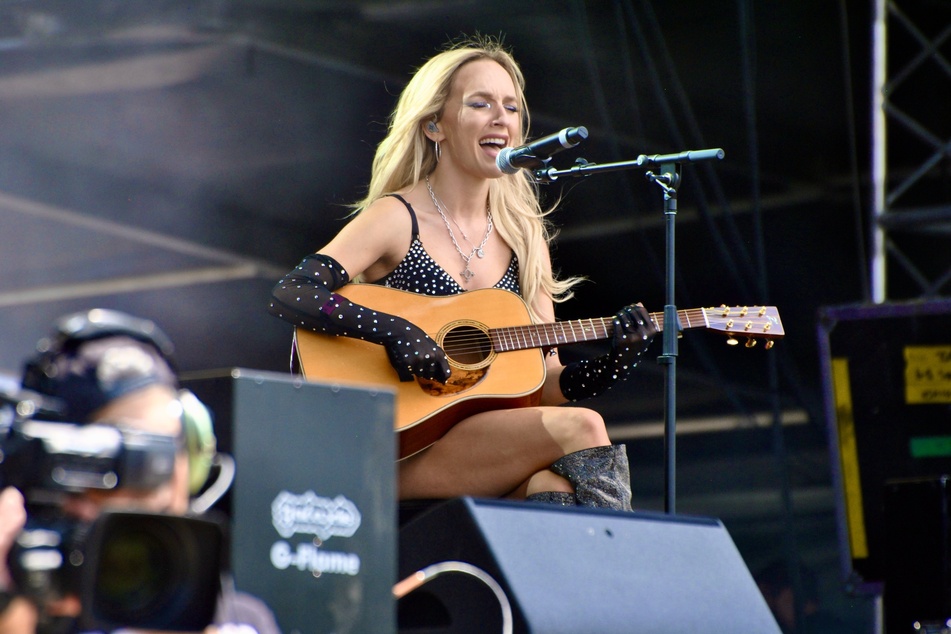 Zolita performing a song on acoustic guitar during Day 2 of Governors Ball Music Festival on Saturday, June 10, 2023.