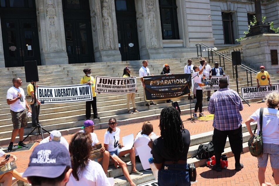 Demonstrators rally for reparations outside the Newark City Hall in New Jersey on Juneteenth 2022.
