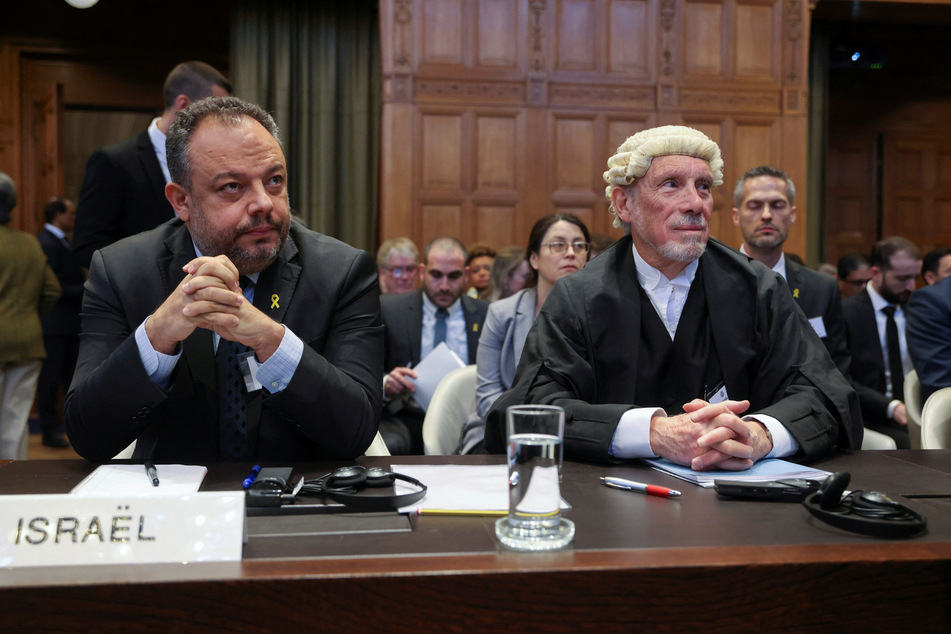 British jurist Malcom Shaw and legal adviser to Israel's Foreign Ministry Tal Becker look on as judges at the International Court of Justice hear a request for emergency measures to stop Israel's military actions in Gaza.