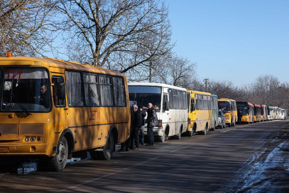 Buses carrying evacuees from the separatist regions in eastern Ukraine .