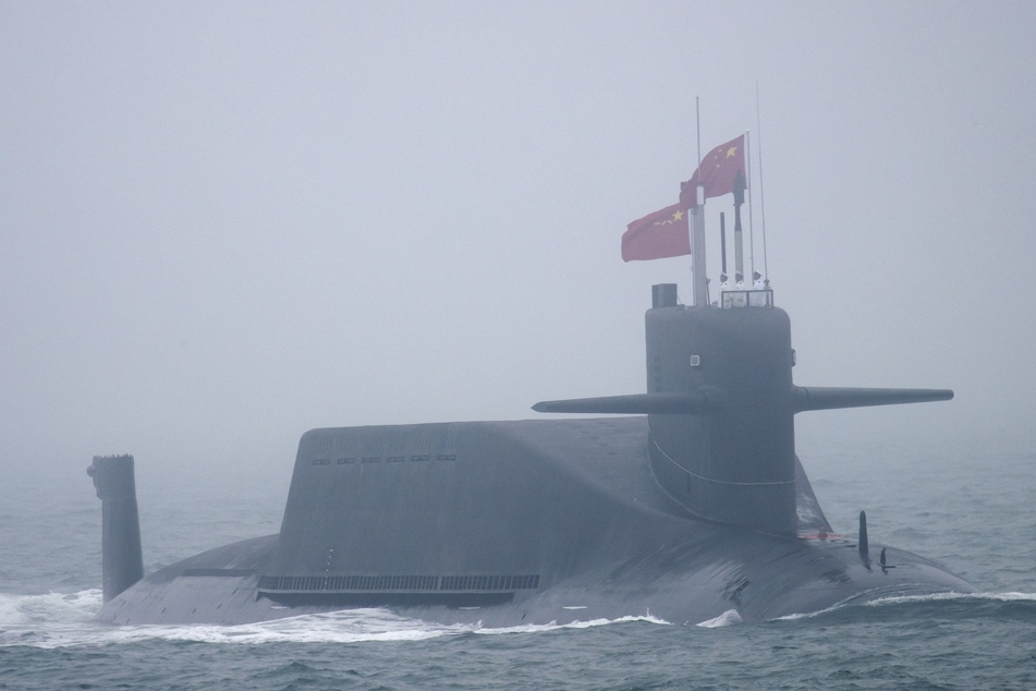 A 094A Jin-class nuclear submarine of the Chinese People's Liberation Army (PLA) Navy participates in a naval parade to commemorate the 70th anniversary of the founding of China's PLA Navy on April 23, 2019.