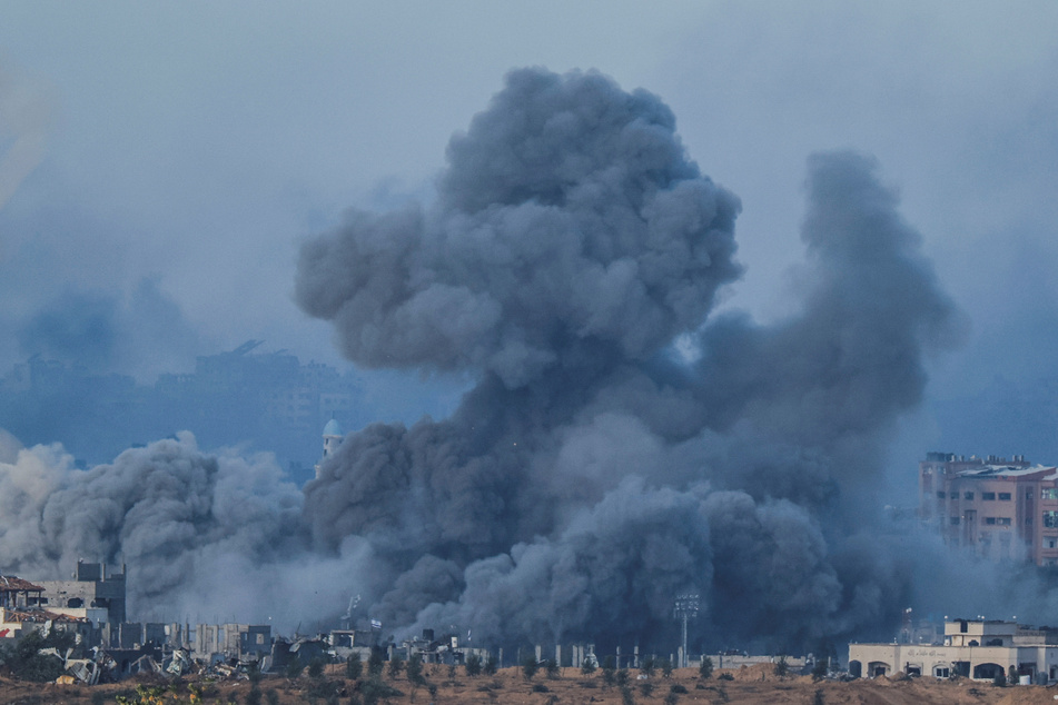 Smoke rises after Israeli air strikes in Gaza, as seen from southern Israel, on November 21, 2023.
