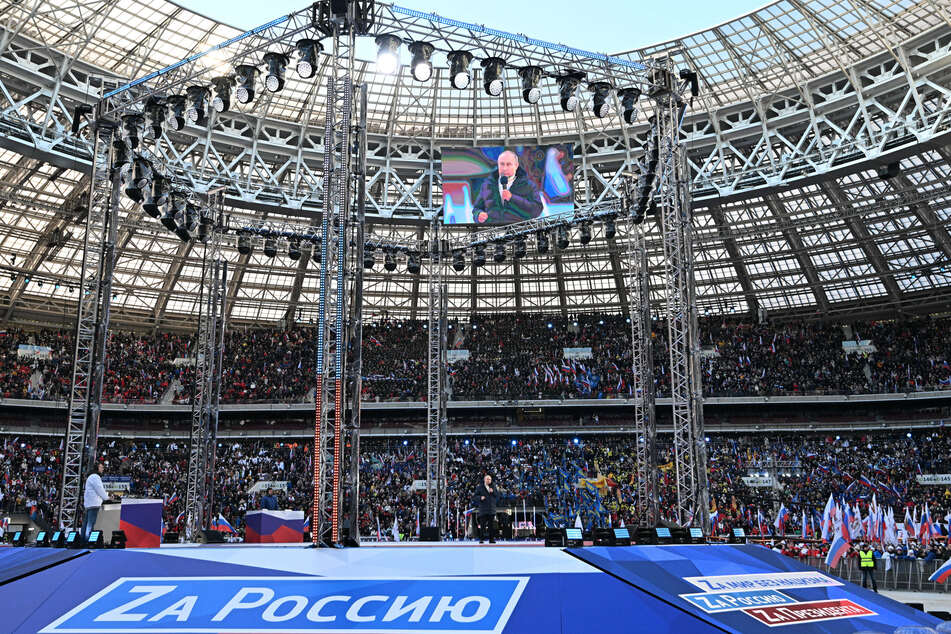 Russian President Vladimir Putin addresses the audience at a "patriotic" rally in Moscow.