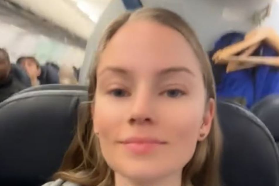 Laina proudly films herself on the plane, which she says is first class.