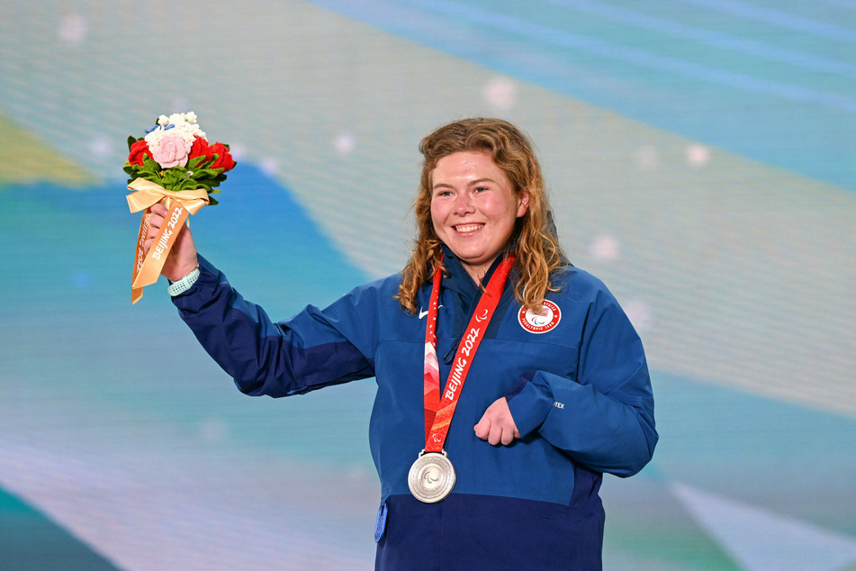 Sydney Peterson of the USA poses for photos with her first-ever silver medal after placing second in the Women’s Long-Distance Standing (Classic) Final.