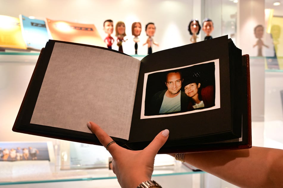 A photo album given Jennifer Aniston to fellow Friends cast members Matthew Perry and Courtney Cox is displayed ahead of The Matthew Perry Estate Auction at Heritage Auctions in Beverly Hills, California, on May 19, 2026.