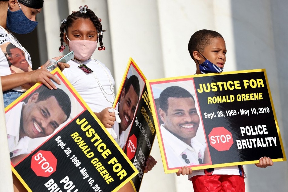 Family members of Ronald Greene participate in the Commitment March: Get Your Knee Off Our Necks protest against racism and police violence at the Lincoln Memorial in Washington DC on August 28, 2020.