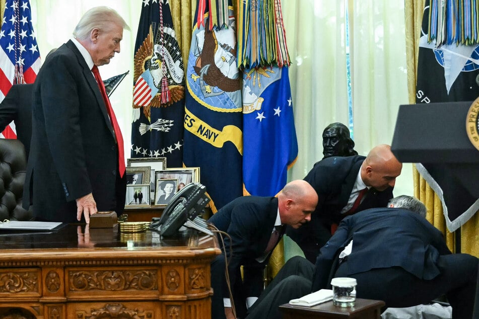 President Donald Trump (l.) was forced to suspend an Oval Office event on Thursday when a representative of a pharmaceutical company fainted.