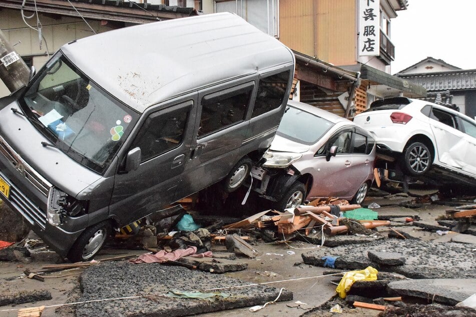 Vehicles sit piled up after being washed up by a tsunami in the city of Suzu, Ishikawa prefecture on January 3, 2024, after a major 7.5 magnitude earthquake struck the Noto region in Ishikawa prefecture on New Year's Day.