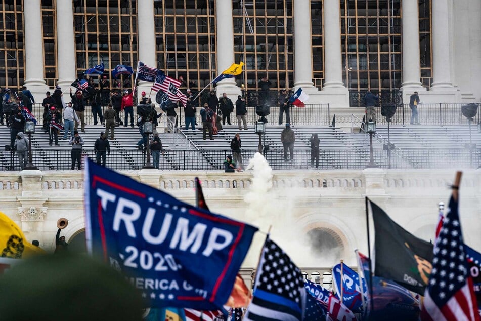 Supporters of US President Donald Trump clash with the US Capitol police during a riot at the US Capitol on January 6, 2021, in Washington, DC.