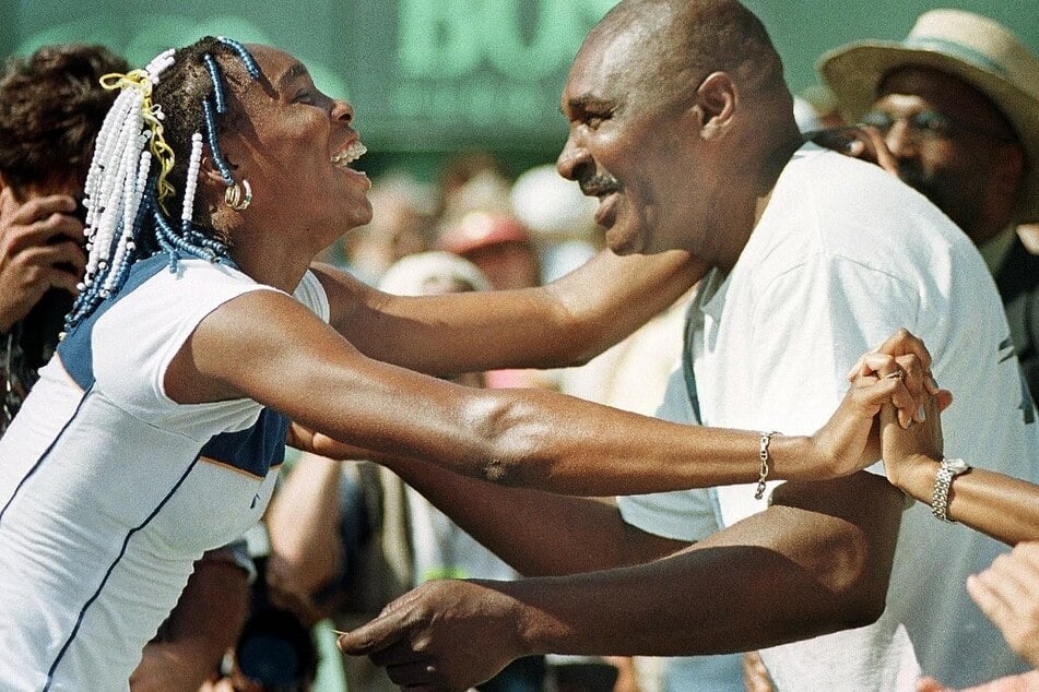 Venus (l) and father Richard (r) celebrating after a match win.