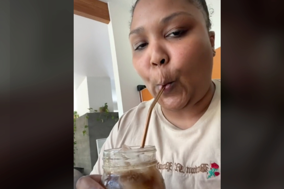 Lizzo sips her hard-earned drink in a new TikTok.