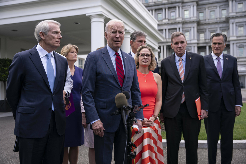 Joe Biden and a bipartisan group of lawmakers announced their infrastructure deal outside the White House on Thursday.