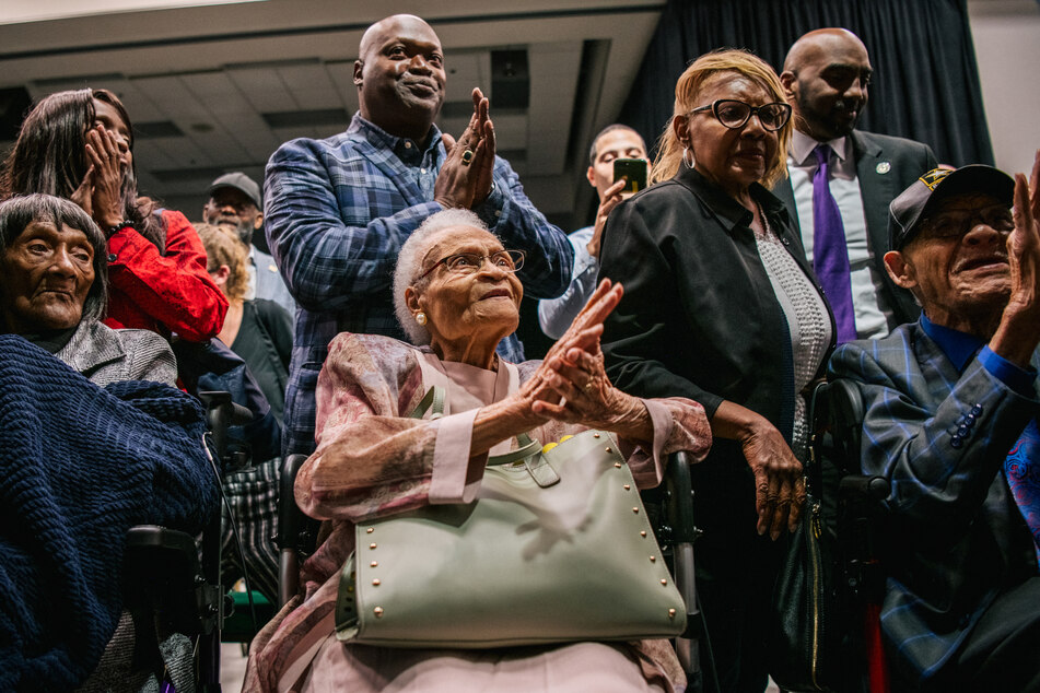 From l. to r.: Lessie Benningfield Randle, Viola Fletcher, and Hughes Van Ellis sing together during commemorations of the 100th anniversary of the Tulsa Race Massacre.