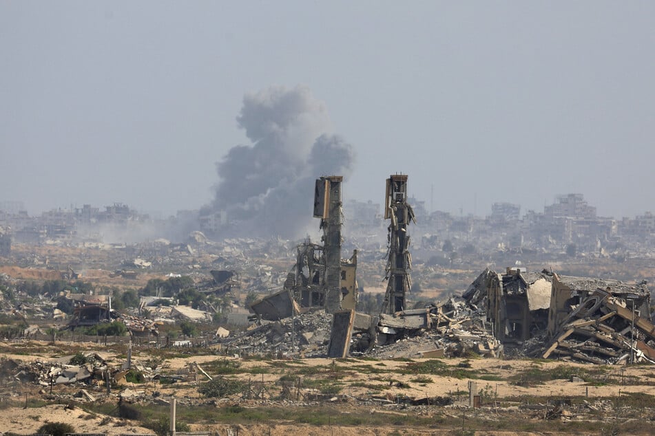 Smoke rises following Israeli strikes on Gaza City after Hamas agreed to a ceasefire deal, as seen from the central Gaza Strip on October 4, 2025.