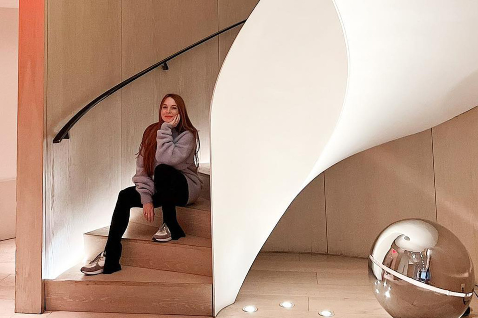 Lindsay Lohan shared another photo of herself on a sprawling staircase during her stay at the New York EDITION hotel.