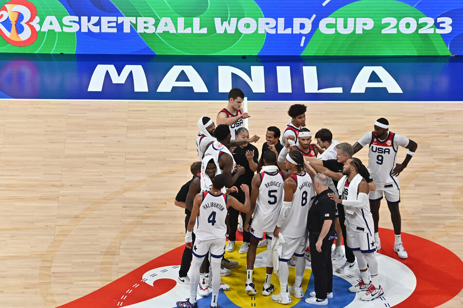 United States players celebrate after winning their match against Jordan at the 2023 Basketball World Cup.