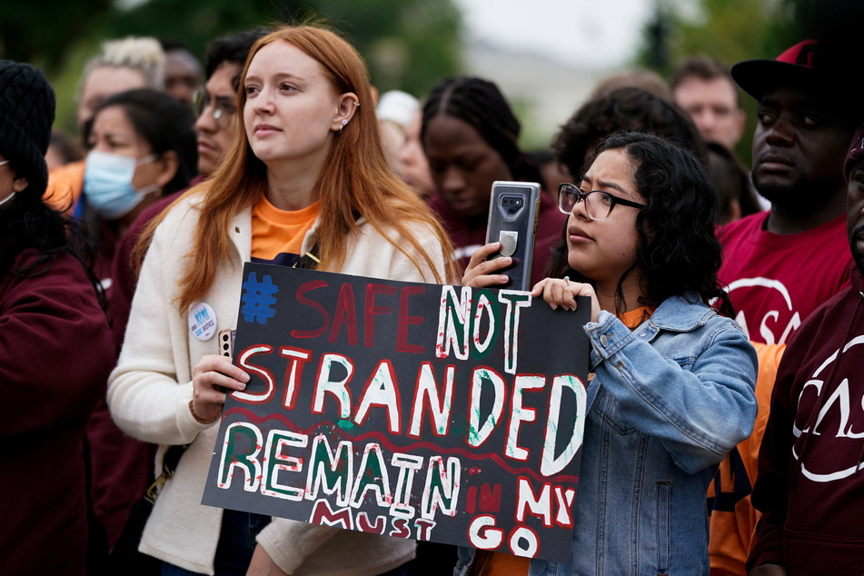 Protesters attend the Safe Not Stranded rally outside the Supreme Court in Washington DC.