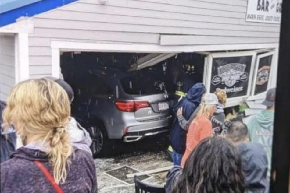 The silver SUV drove through the front of the Looney Bin Bar &amp; Grill in Laconia, New Hampshire, on Sunday.