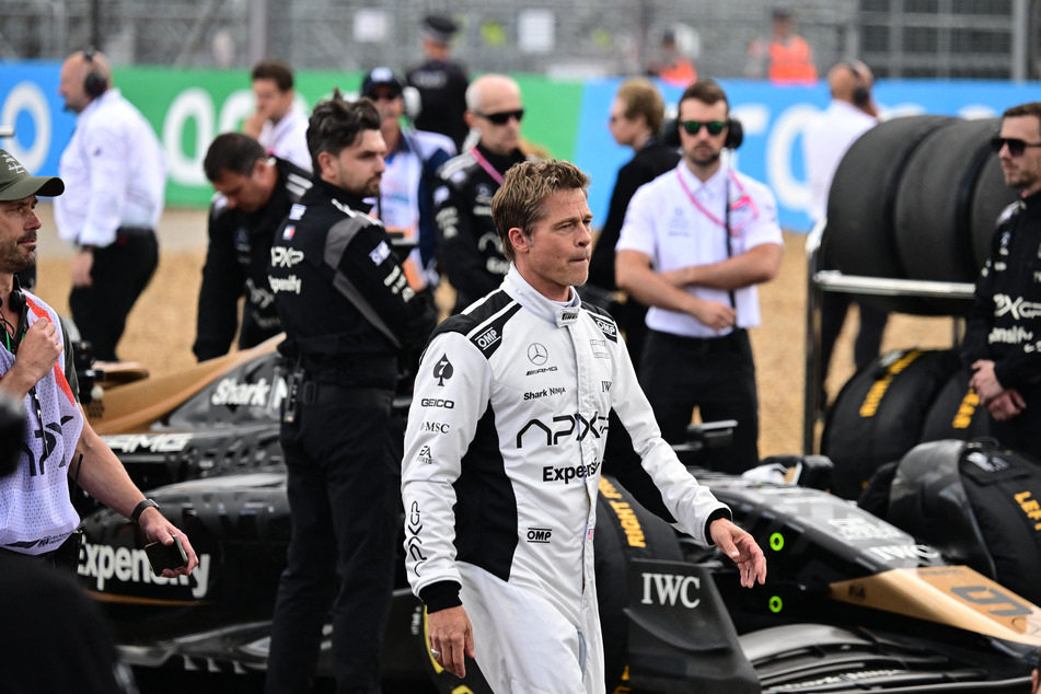 Brad Pitt wore a racing suit and mingled with real Formula 1 drivers at the Silverstone circuit on Sunday.