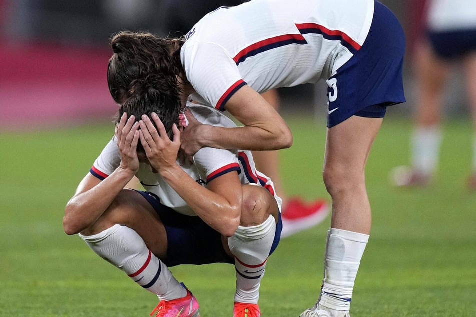 Alex Morgan and Carli Lloyd are dejected at the final whistle of the USWNT's Olympic semifinal loss to Canada.