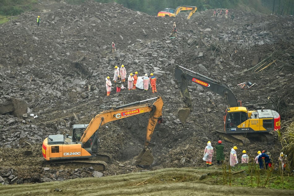 Rescuers work at the site of a landslide in Jinping village in the city of Yibin, in China’s southwest Sichuan province on Sunday.