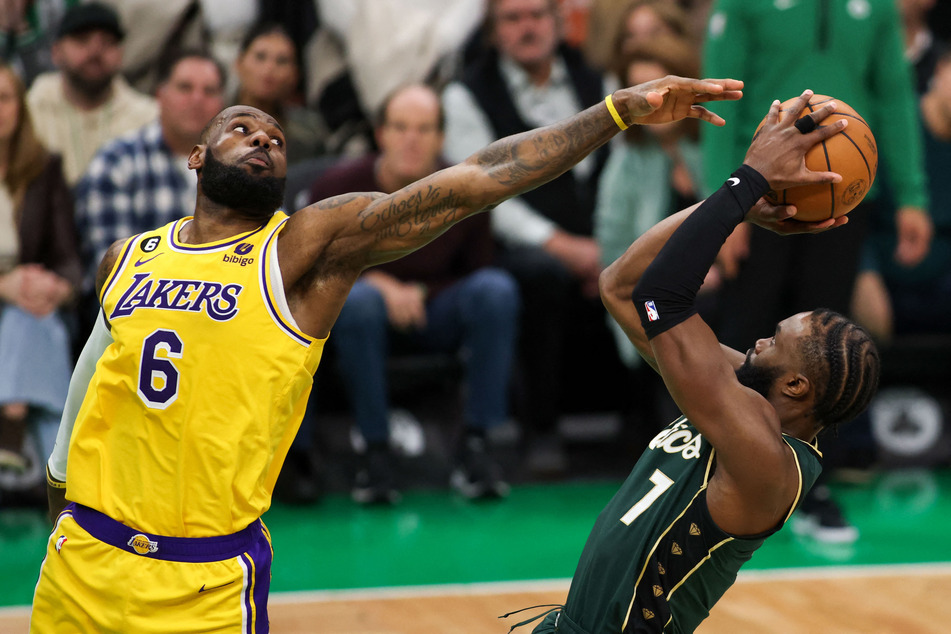 Boston Celtics forward Jaylen Brown shoots while defended by Los Angeles Lakers forward LeBron James during the second half at TD Garden.