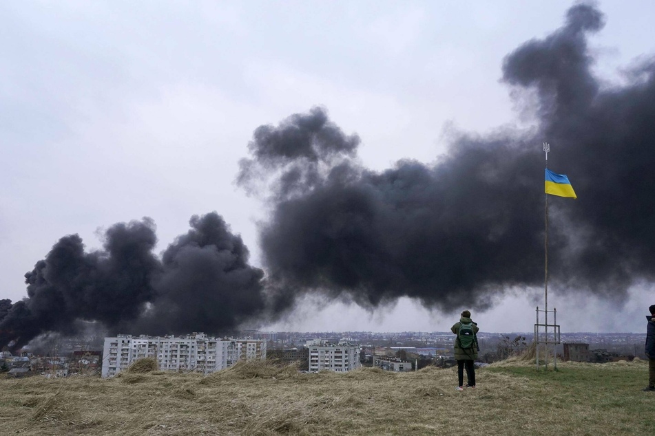 Black smoke rises in the air from an oil storage facility in Lviv, which was hit by Russian missiles on Saturday.