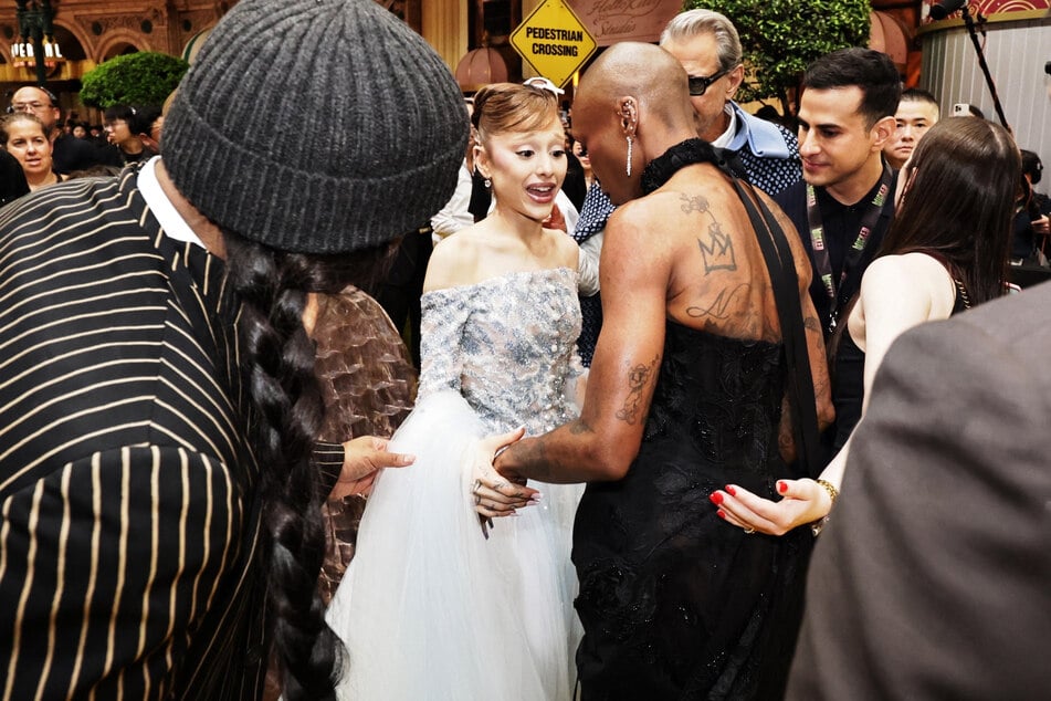 Ariana Grande and Cynthia Erivo are pictured at the premiere of their film Wicked: For Good in Singapore.