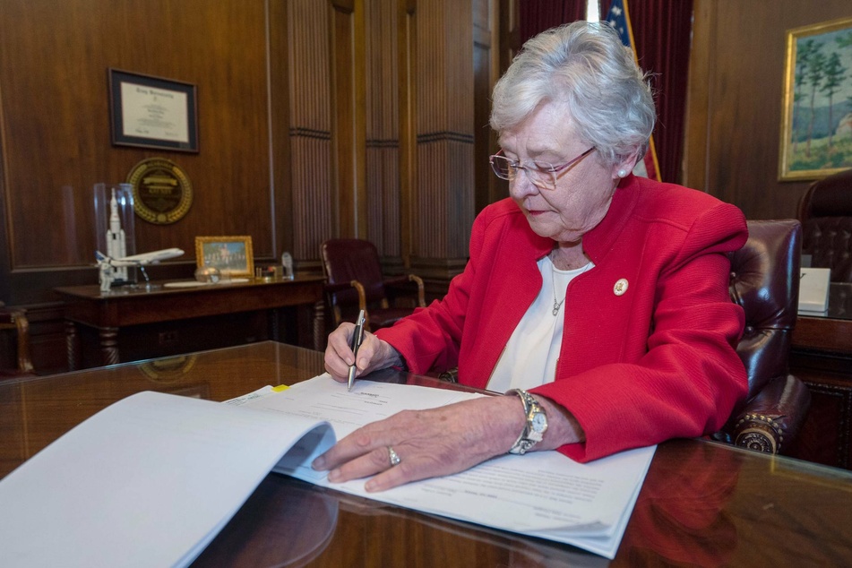 Alabama Governor Kay Ivey, seen here signing a near-total abortion ban into law in 2019.