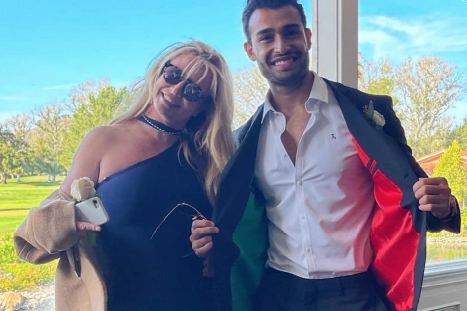 Sam Asghari (r.) defended Britney Spears' viral knife dance despite the backlash from fans.