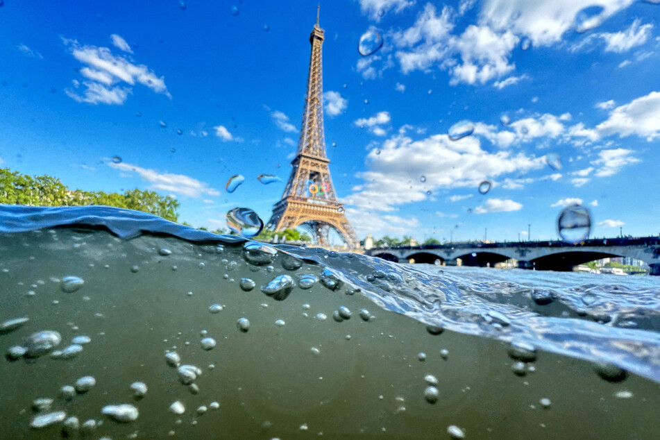 The Eiffel Tower is seen from the water of the Seine River ahead of the Olympics opening ceremony.