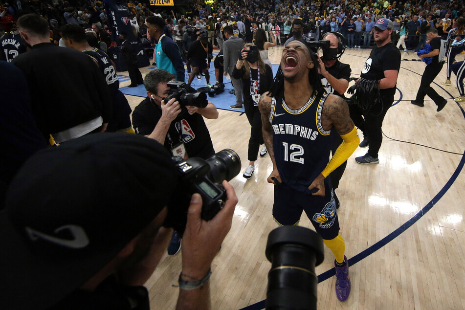 The Grizzlies' Ja Morant celebrates at the end of a hard-fought win over the Warriors.