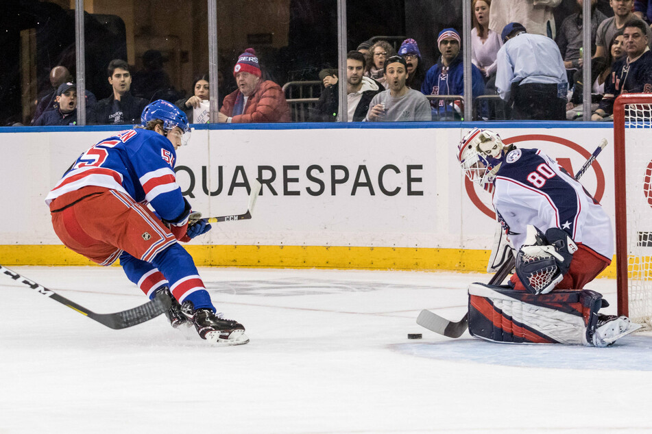 Blue Jackets Goalie (r) Matiss Kivlenieks stops a shot during his first-career NHL win in 2020