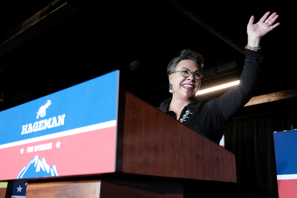 Trump-backed challenger Harriet Hageman smiles and waves during her primary election night party in Cheyenne, Wyoming.