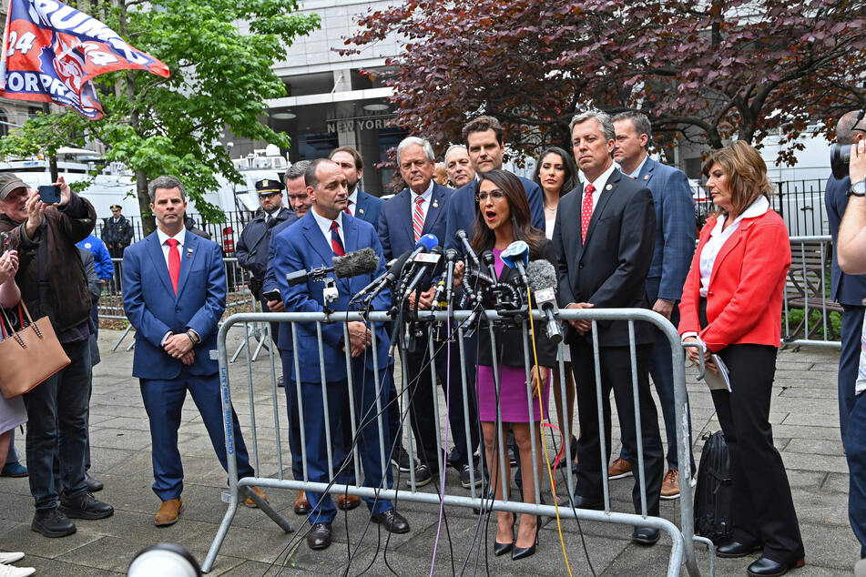 Congresswoman Lauren Boebert (c.) and other MAGA Republicans outside Donald Trump's hush money trial in New York City on May 16, 2024.