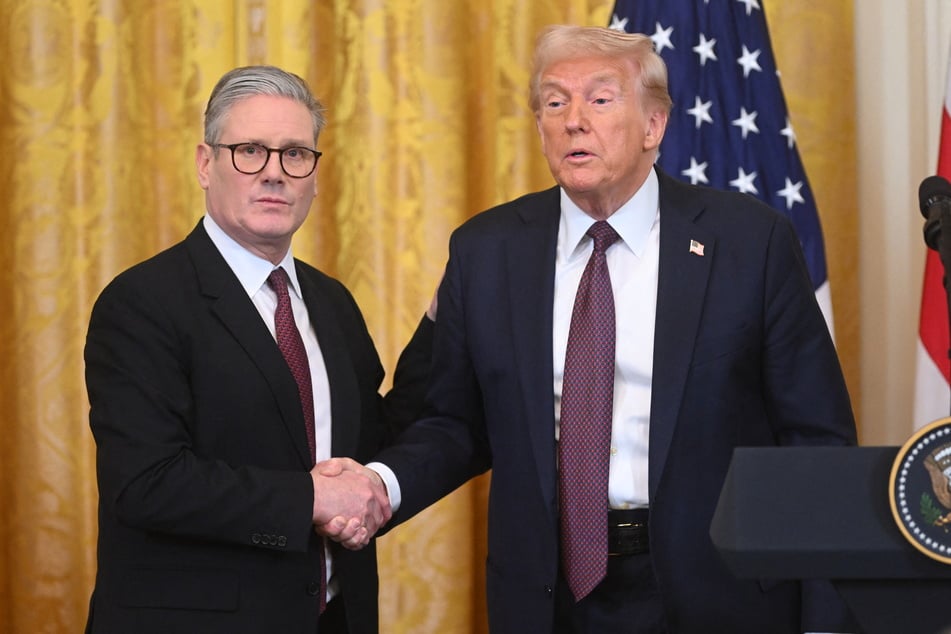 US President Donald Trump (r.) unveiled a "breakthrough" trade agreement with British Prime Minister Keir Starmer (l.) on Thursday, celebrating the first deal in a tariff war that has rattled the world.