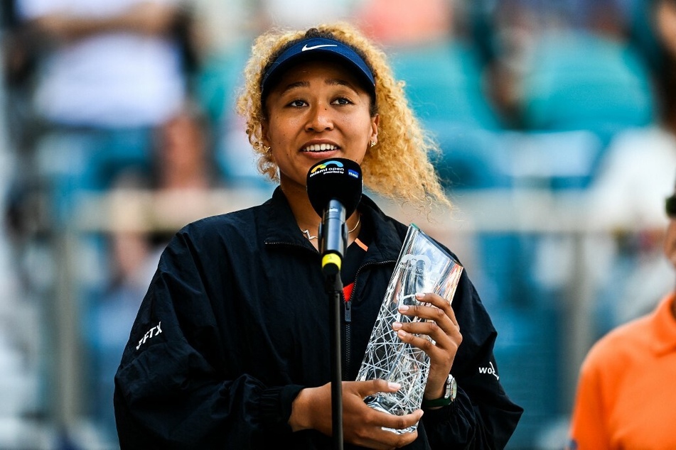 Osaka receives the trophy following the women’s single finals at the 2022 Miami Open.