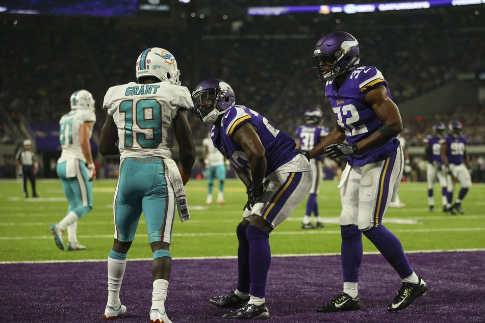Vikings cornerback Mackensie Alexander (c) was penalized for taunting Miami Dolphins wide receiver Jakeem Grant (l) after he successfully defended him the in the end zone.