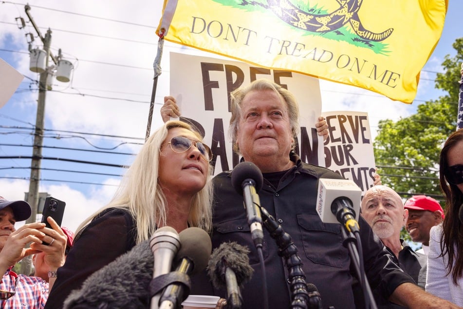 Marjorie Taylor Greene (l.) and Steve Bannon speaking during a press conference outside the federal correctional institution in Danbury, Connecticut on July 1, 2024.