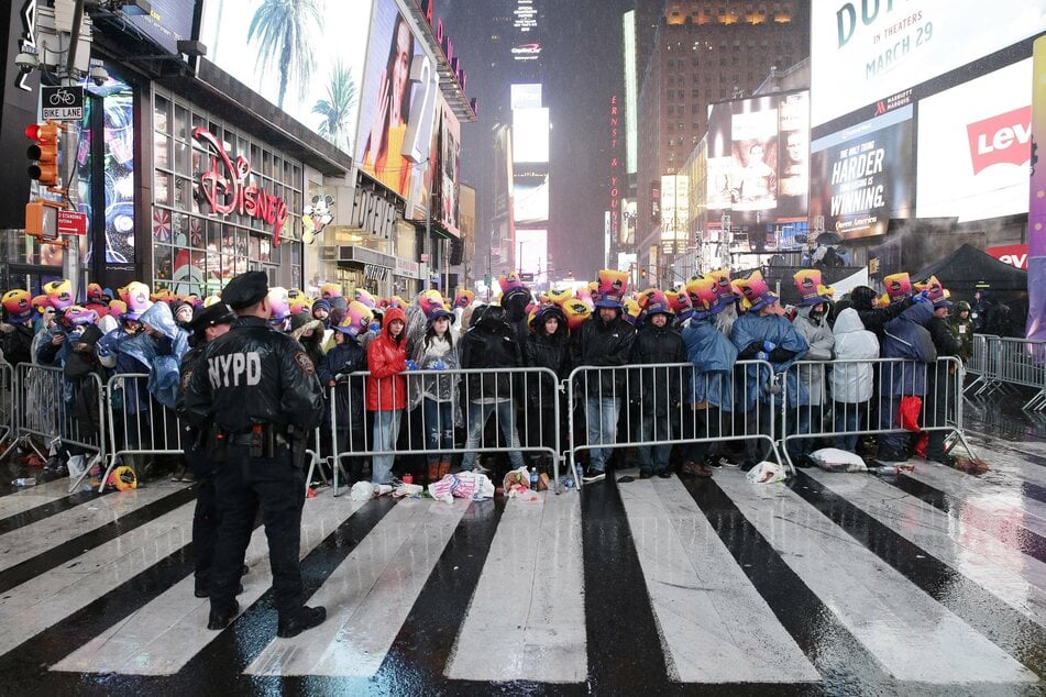 Revelers have stood in the rain, snow, and below freezing temperatures to watch the Ball Drop in NYC's Times Square for over one hundred years.