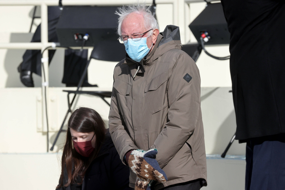 Bernie Sanders (r.) sported a brown coat, wool mittens, and a surgical face mask at Joe Biden's inauguration.