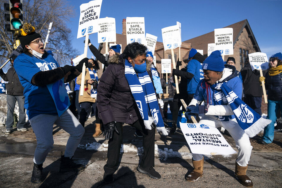 Picketers brave the Minneapolis cold to stand – and dance – in solidarity with striking educators.