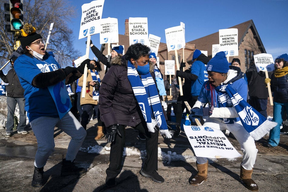 Picketers brave the Minneapolis cold to stand – and dance – in solidarity with striking educators.